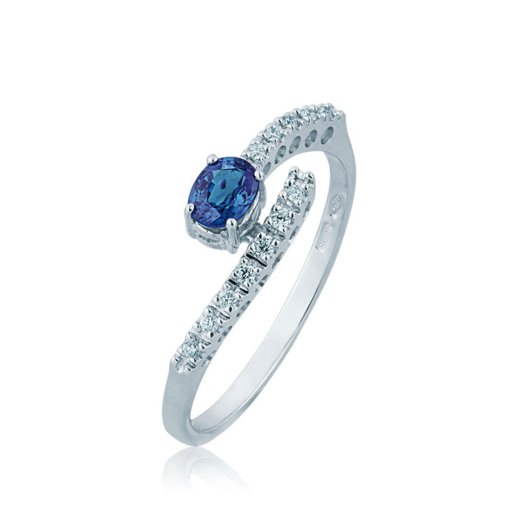 White Gold Woman Ring With Embrace Of Diamonds And Blue Sapphire Oval Cut Valenza Jewelry