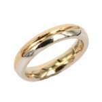 Pair of Unoaerre wedding rings in white and yellow gold, comfortable eclipse model